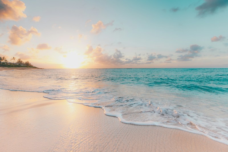 Sunny bright coastal beach and luxury travel destination